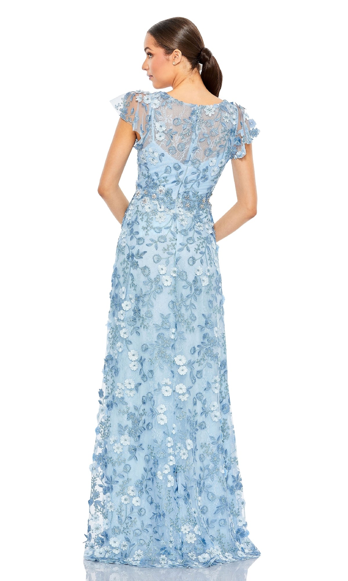 Woman wearing the Long Beaded Formal Dress: Mac Duggal 68192—an elegant, light blue evening gown with floral lace and short flutter sleeves—seen from the back against a white background.